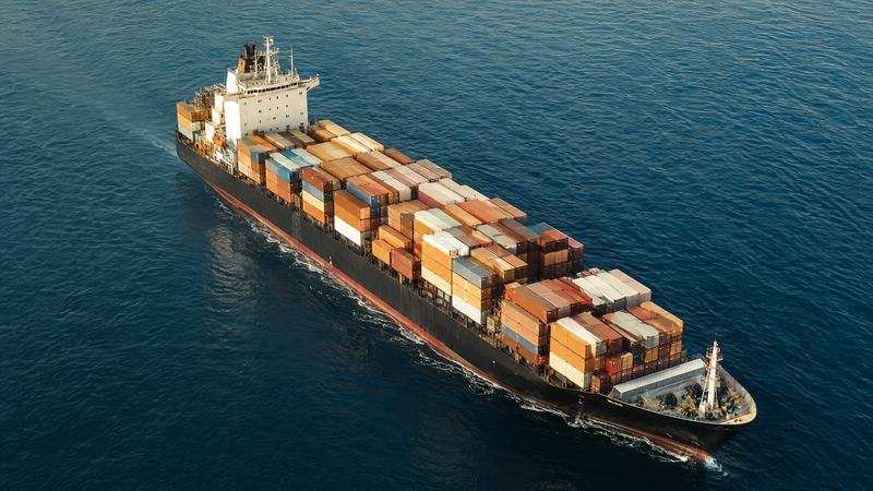 Aerial view of a loaded container ship at sea