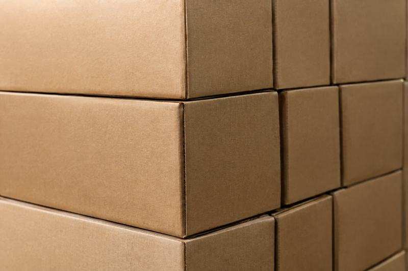 Close view of stacked plain brown corrugated cartons
