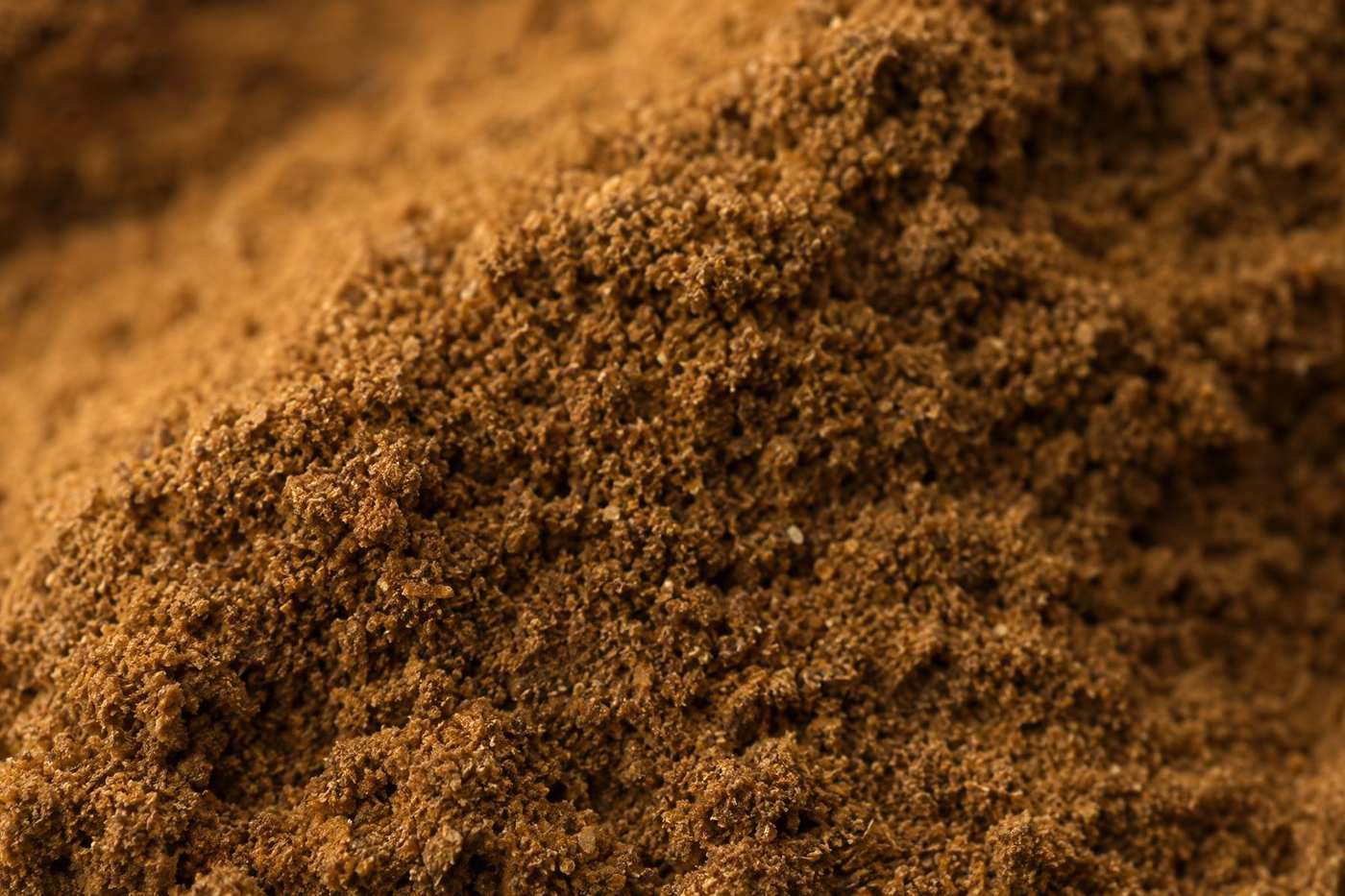 Close-up of the granular texture of fine tobacco dust